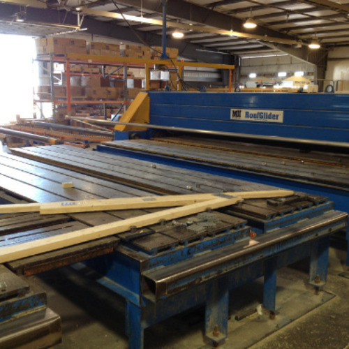 Industrial warehouse with large blue machines labeled 