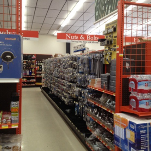 A hardware store aisle labeled 