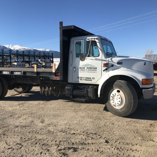 A white flatbed truck with 
