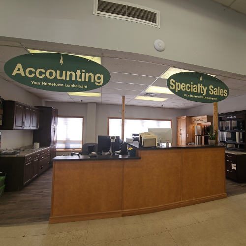 A welcoming office space with two sections marked by green signs: 
